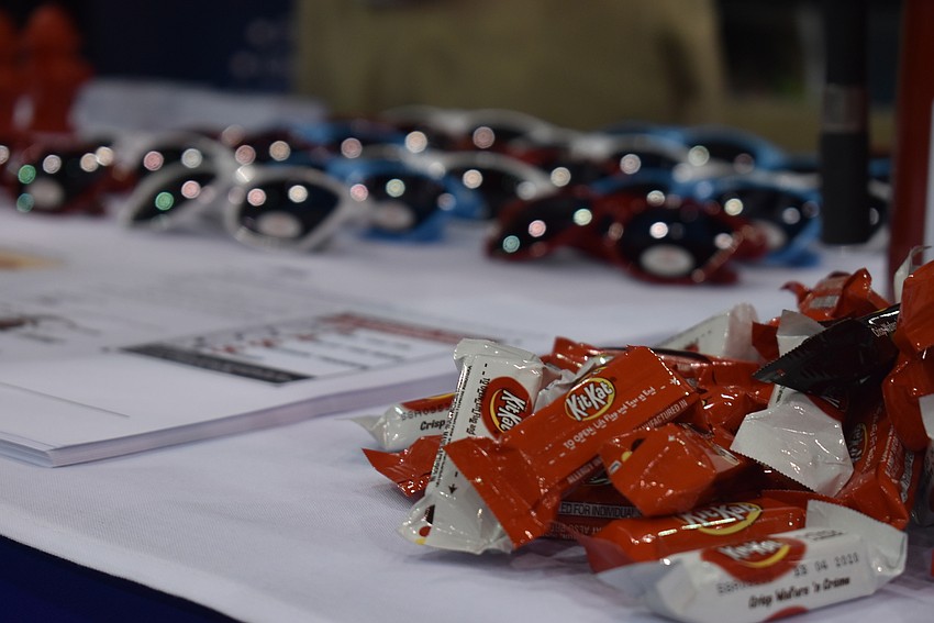 Many tables lured in new contacts with bright tables of candy and branded merchandise.