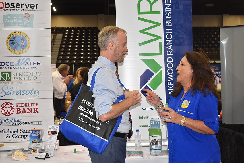 Jeffery Kin chats with Yasemin Chain at the joint LBK-LWR booth.