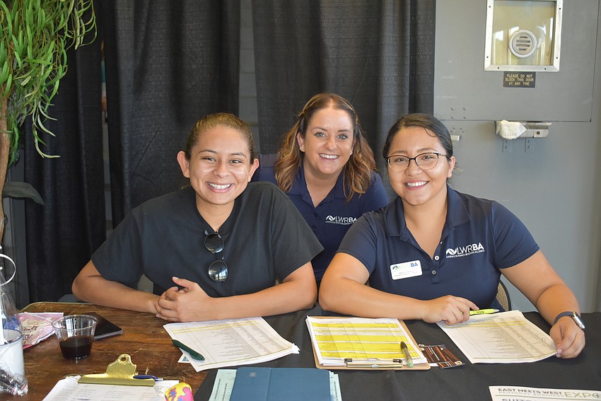 Karen Murillo, Caitlyn Driscoll and Janeth Gonzalez ran the front end of the event, letting people in.