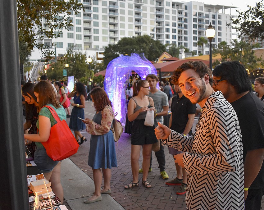 Ringling College of Art and Design student Stefan Carpenter waits in line for pizza.