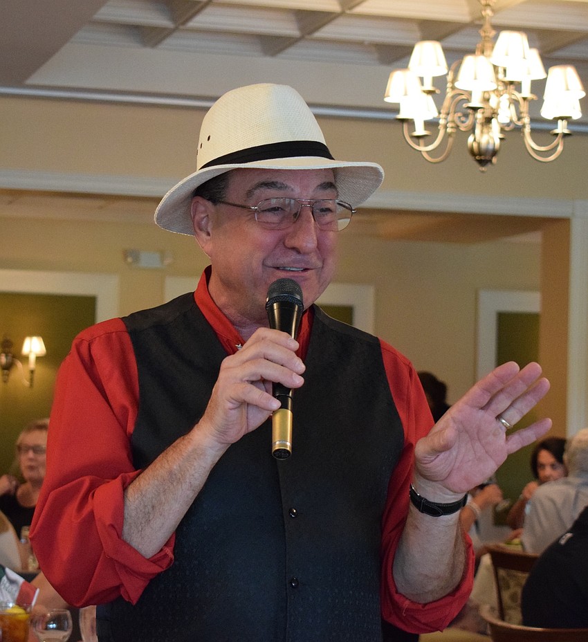 Rob Satori serenades a table of guests during the annual San Gennaro Festival at Tara Golf and Country Club.