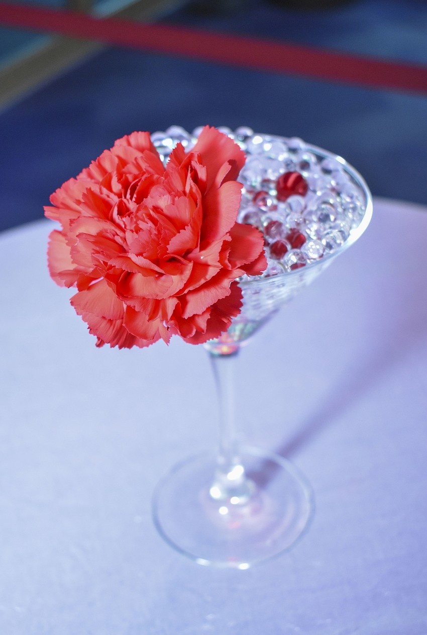 Martini glasses lined each cocktail table.