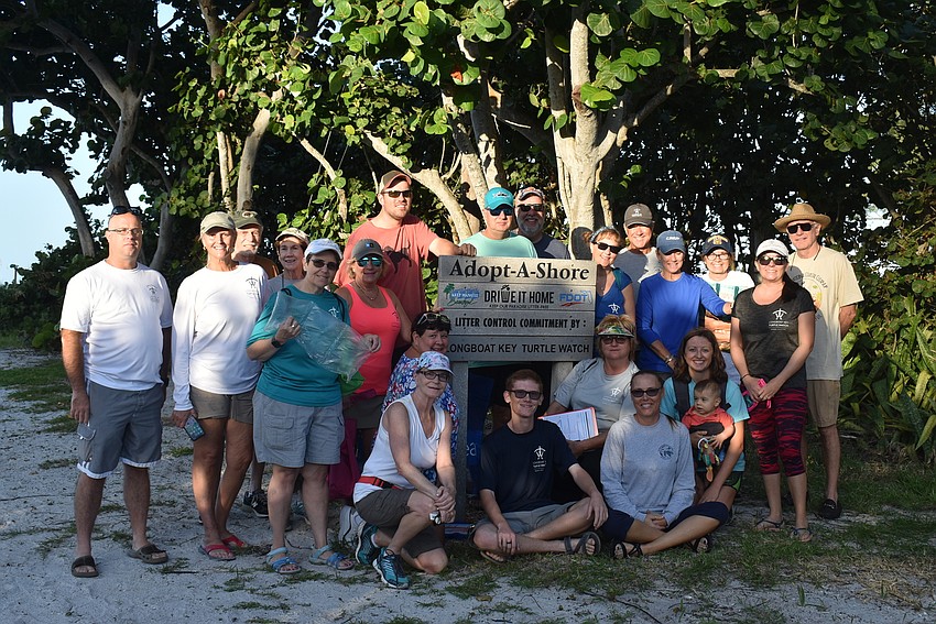 The cleanup participants gather for a group photo before heading out.