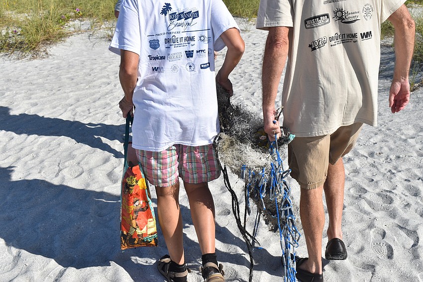 Olga and Peter Stokes haul back some netting.