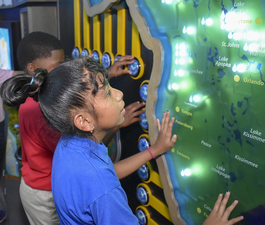 Alondra Capiz learns about rainfall in different Florida cities.