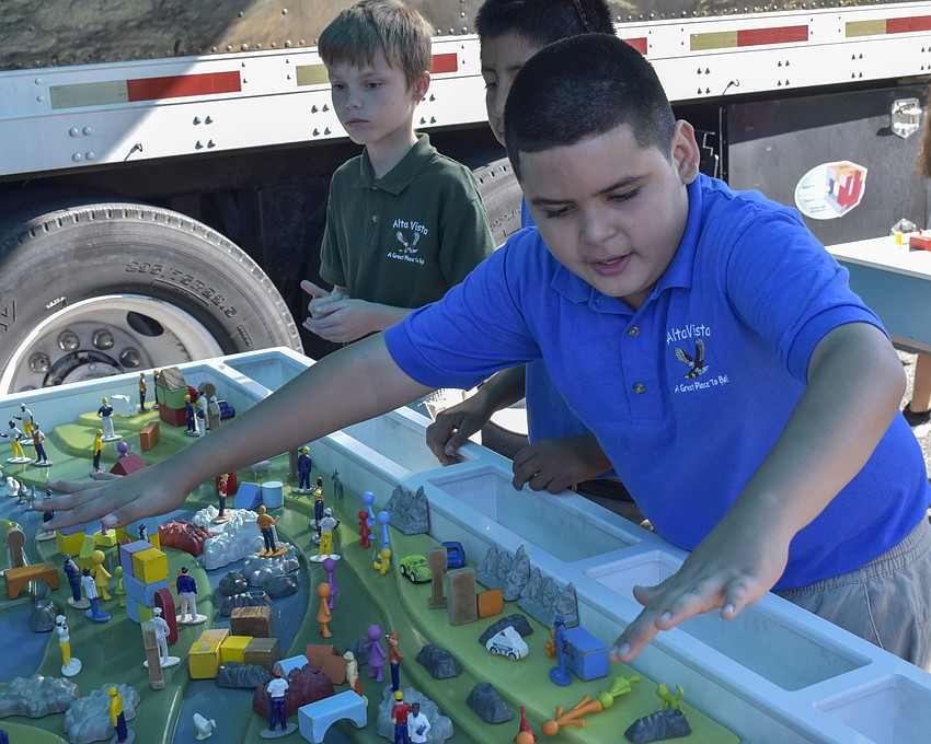 Angel Hernandez explains where the trees need to be laid out for the watershed the stay fresh.