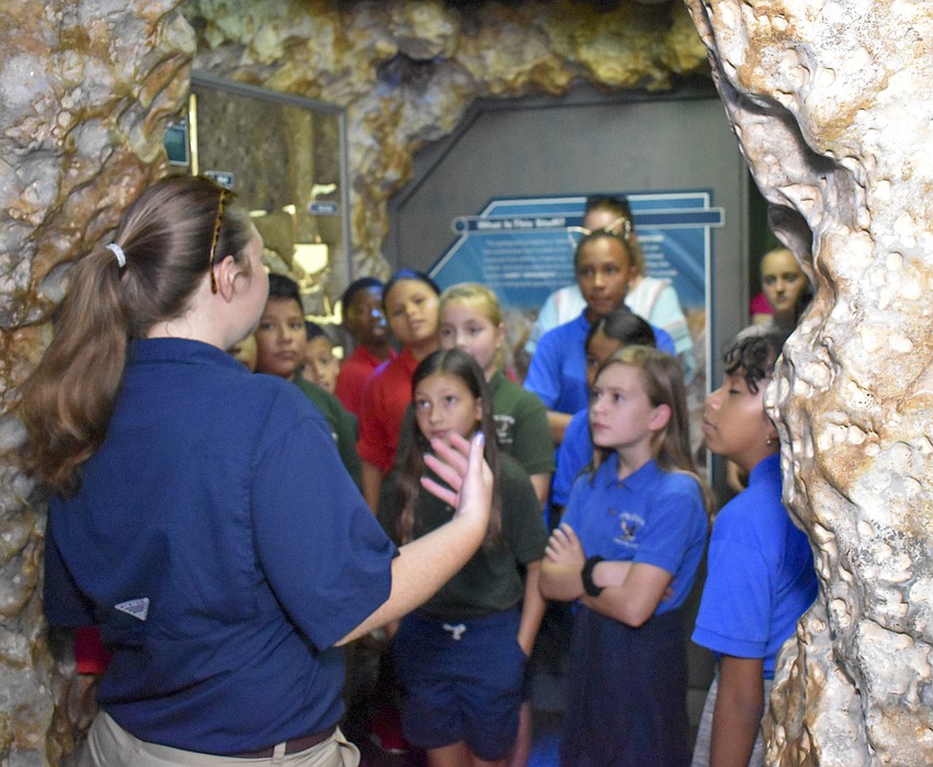 Kathleen Copeland-Fish tells the students they can click every button they want in the  WaterVentures science lab.