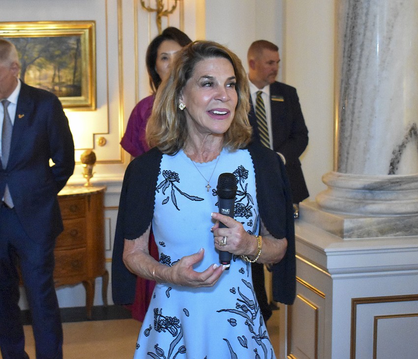 Katherine Harris welcomes guests to her home.