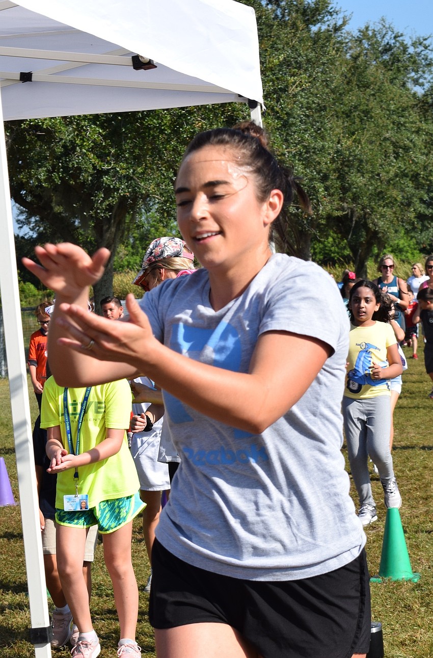 Kayla Christie, a second-grade teacher at Robert E. Willis Elementary School, dances to the song 