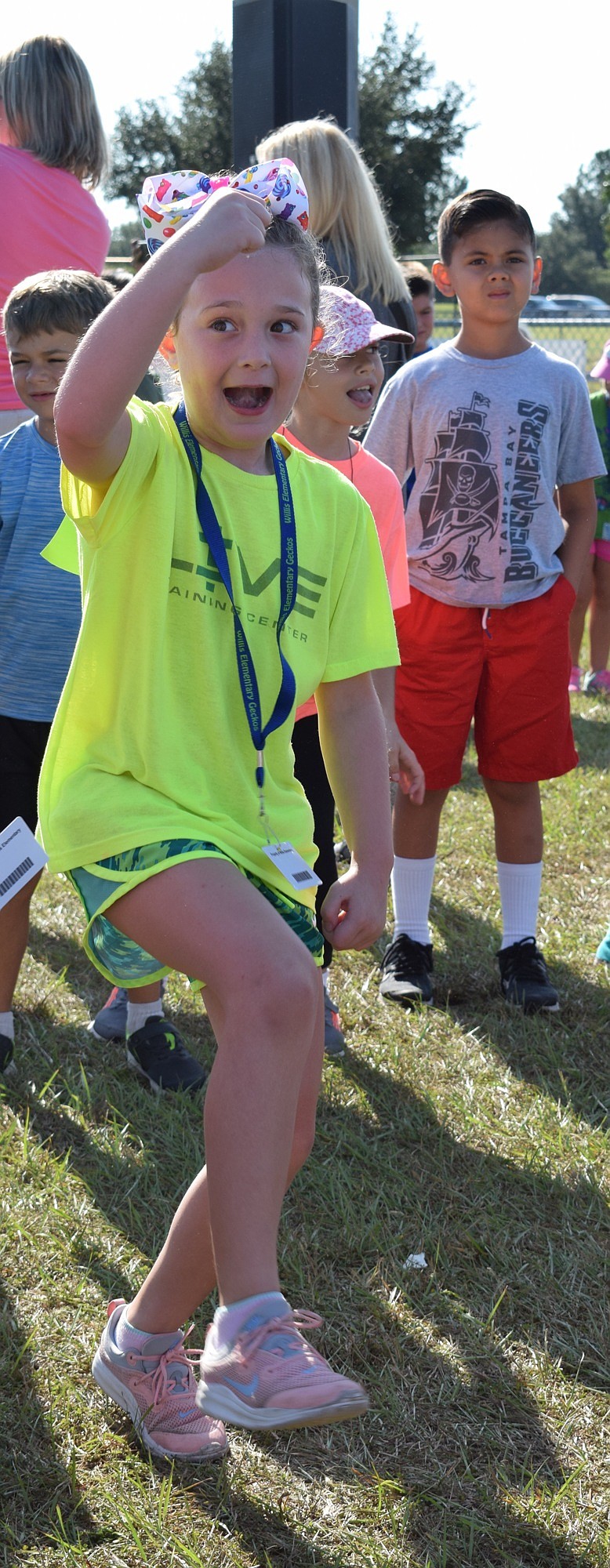 Second-grader Quinn Eddy dances before starting the walk-a-thon. She said it was nice to get a break from class to participate in the fundraiser.