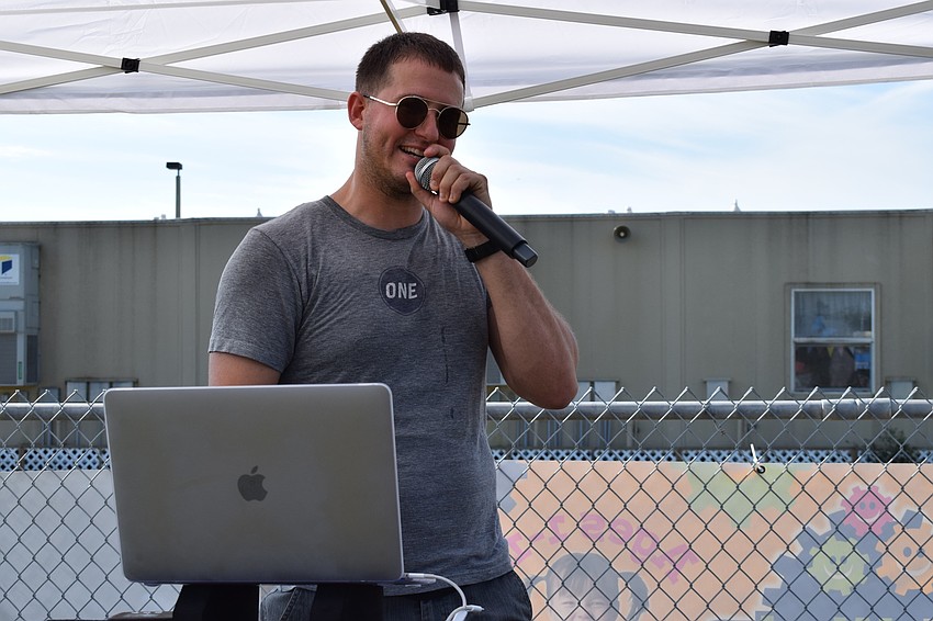 Michael Housefield, also known as DJ Ironmike, gets students pumped for the walk-a-thon with different music selections while also reminding them to keep hydrated.