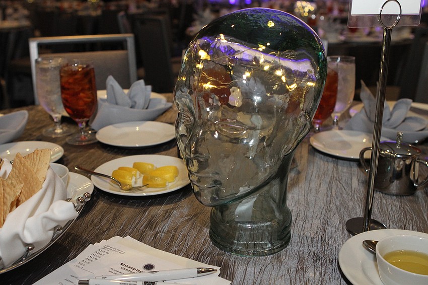 Each table was adorned with a light-filled noggin.