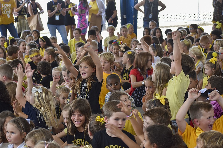 The elementary students celebrate the announcement of who won the weekly mental math problem.