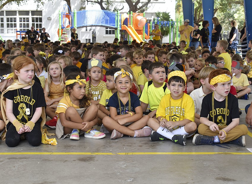 Kindergarteners wait for the pep rally to begins.
