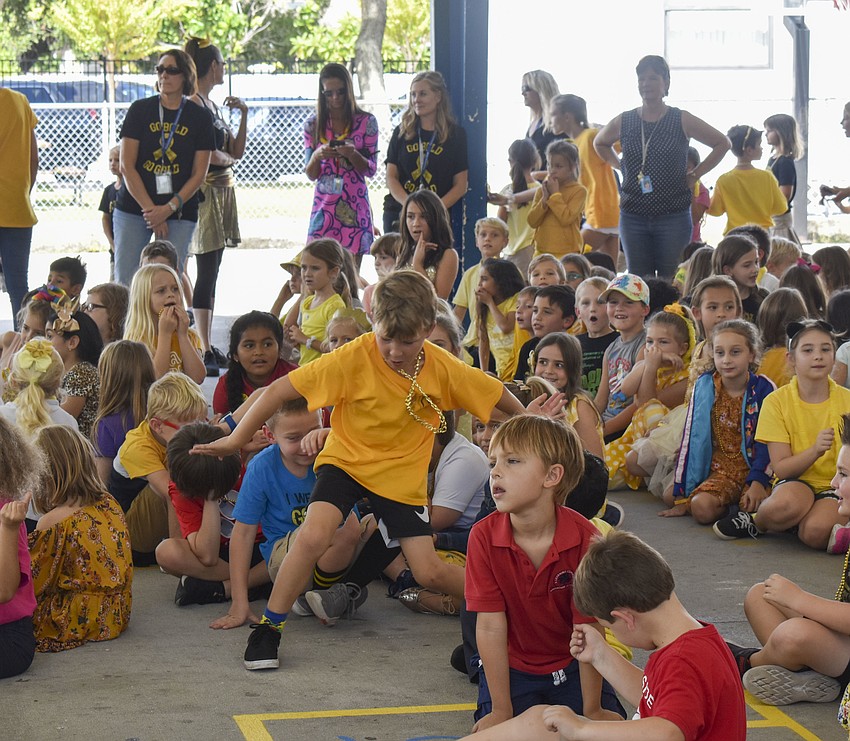 Third grader Asher Morrissey dances to 