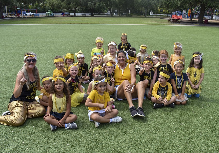 Ms. Manzano and Ms. Sobolewski's kindergarten class poses after winning the weekly mental math problem.