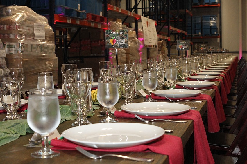 Guests ate family-style inside the All Faiths Food Bank warehouse