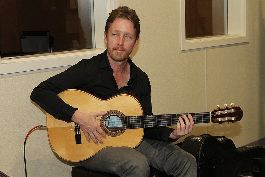 John McLaughlin played guitar.