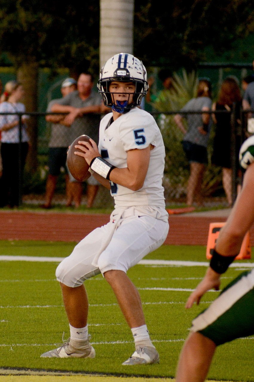 ODA quarterback Tyler Beasley looks for an open receiver.