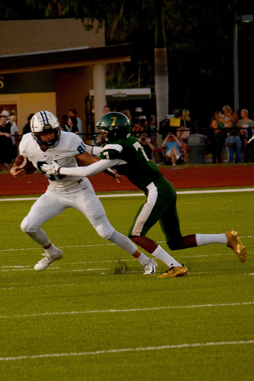 ODA running back Colin Castro stiff arms a Saint Stephen's defender.