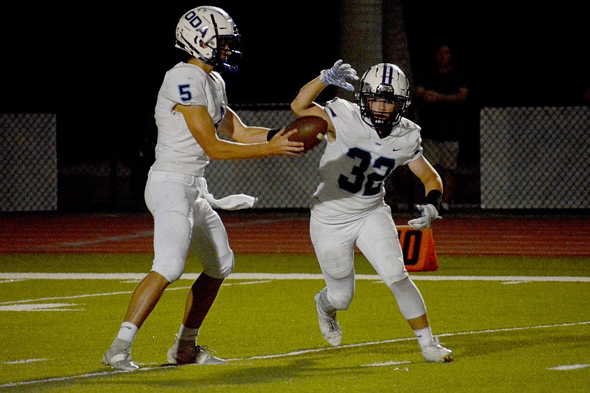 ODA's Luca Marino (32) gets the handoff from Tyler Beasley.