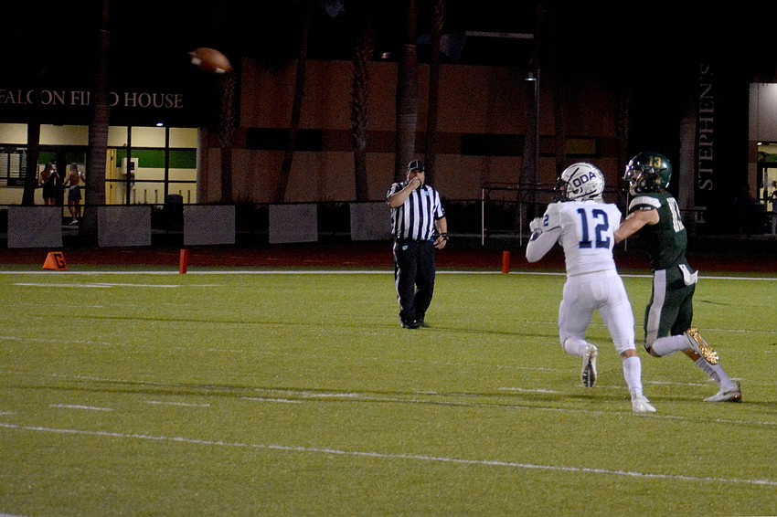 ODA safety Wyatt Carlton (12) breaks up a Saint Stephen's pass.
