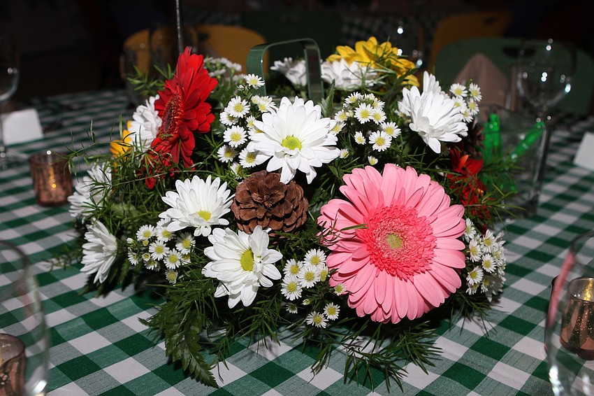 Flowers adorned each dinner table.