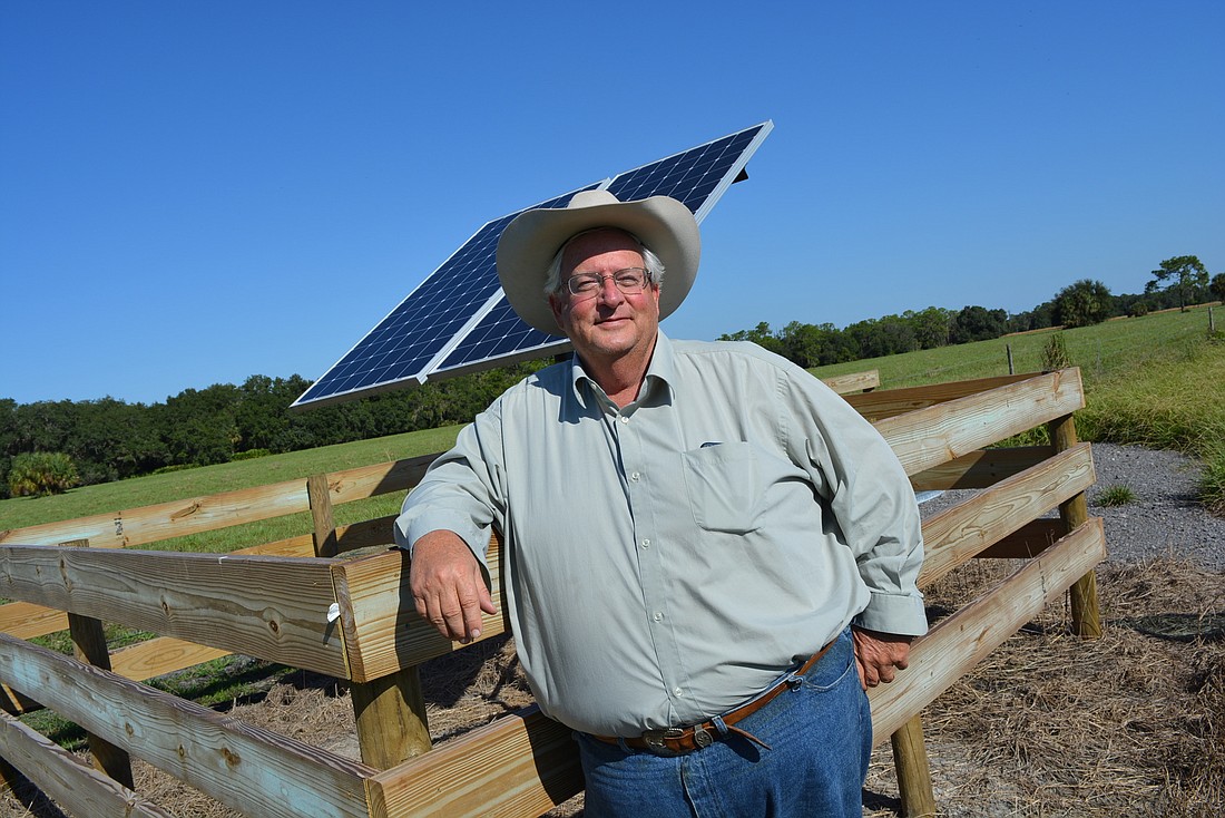 Rancher Jim Strickland shows off one of two solar powered wells he uses to provide drinking water to cattle. Two more wells are planned.