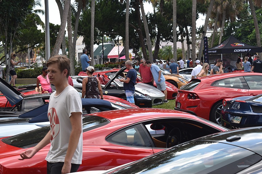 Jack Teske walks through the mass of cars parked on the Cirlce's inner park.