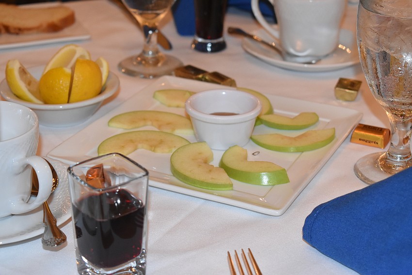 Apples and honey were placed on every table.