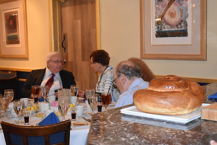 Challah bread awaits the end of the meal.