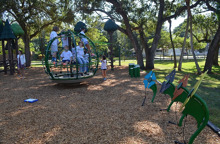 Bay Haven School of Basics Plus students played at the park Tuesday morning after the city cut the ribbon on the new playground.