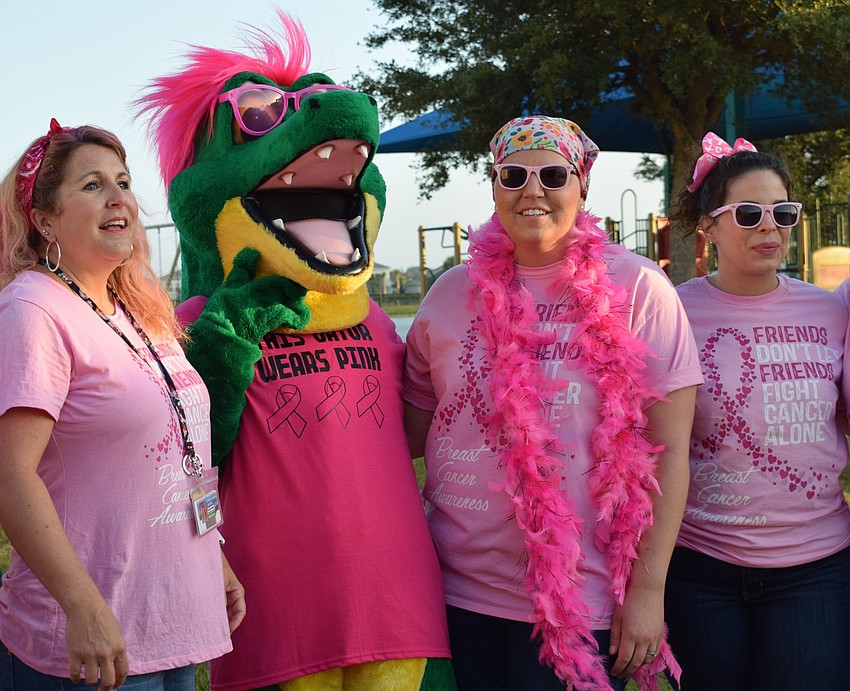Fourth-grade teachers Lee Anne Durkee, Sarah Body and Danielle Herrmann join Chompy, the mascot,. Body was diagnosed with breast cancer in May 2018.