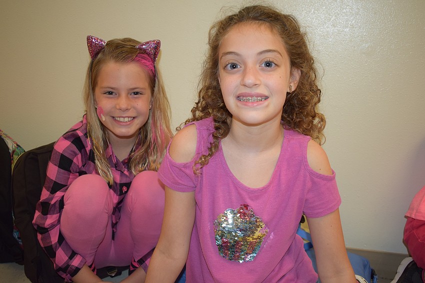 Fourth-graders Anna Kayan and Hannah Wilk dressed in pink. Kayan said she wanted to 