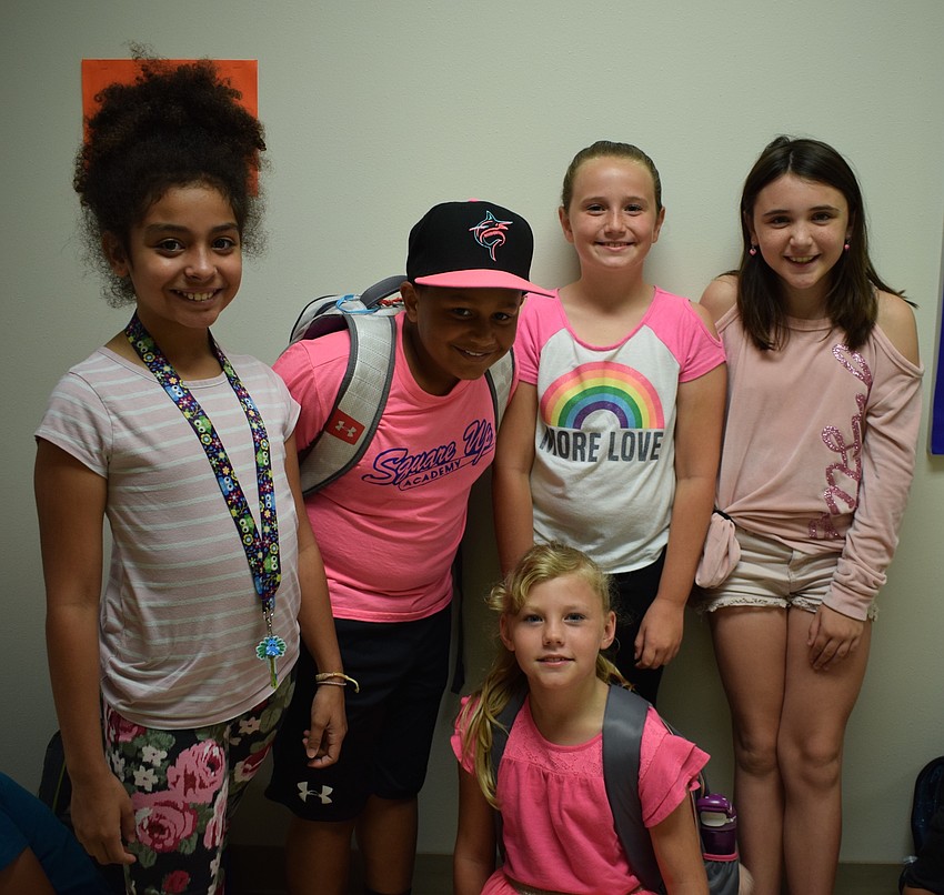 Fourth-graders Vanessa Vazquez, Jayson Franklin, Ashlyn Withers, Jordyn Forest and Elizabeth Suggs all wear pink.