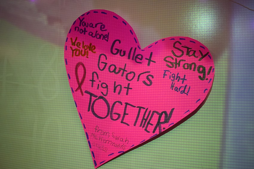 Students wrote messages on hearts and posted them as decorations.