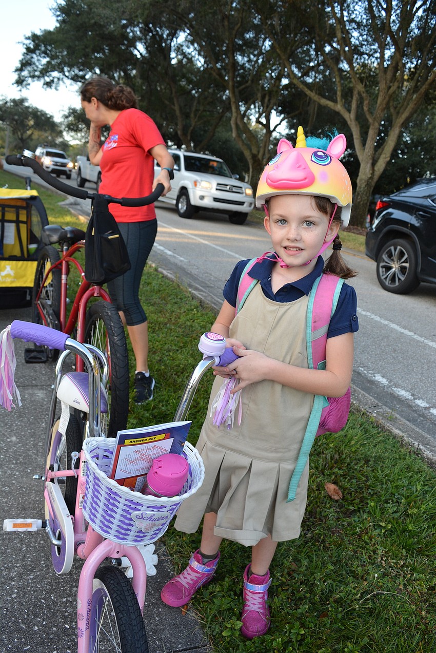 First-grader April Johnson rode her bike to school for the first time.