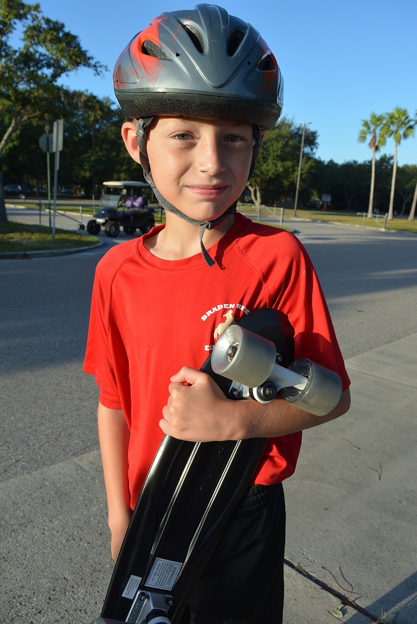 Fourth-grader Ronnie Anderson liked that he could ride his skateboard to school. He will take it to school more now that the weather is cooler.
