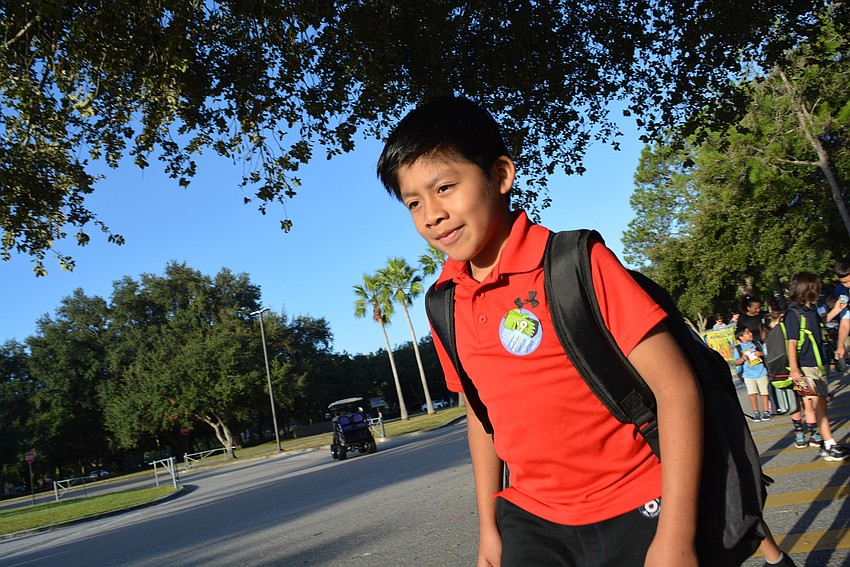 Third-grader Sergio DeLeon liked being outside instead of inside a car.