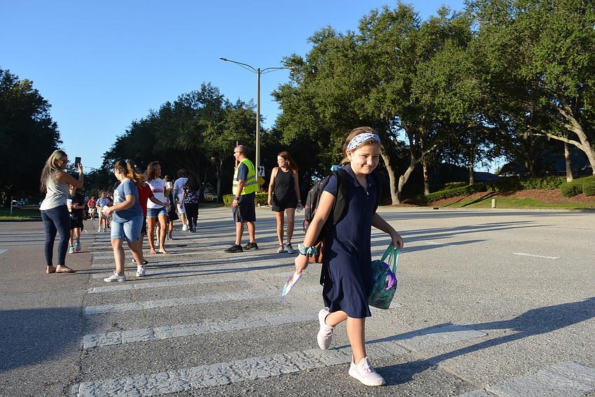 Gabby Pisani walked with friends and family from River Club.