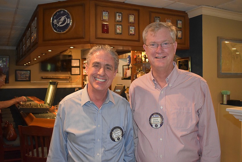 Vice president Michael Garey and Steve Branham.