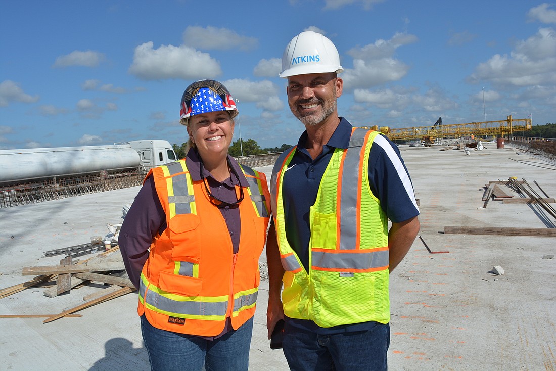 Florida Department of Transportation Interstate Construction Project Manager Marlena Gore and FDOT Communications Outreach Manager Brian Bollas stand atop the new northbound I-75 bridge.