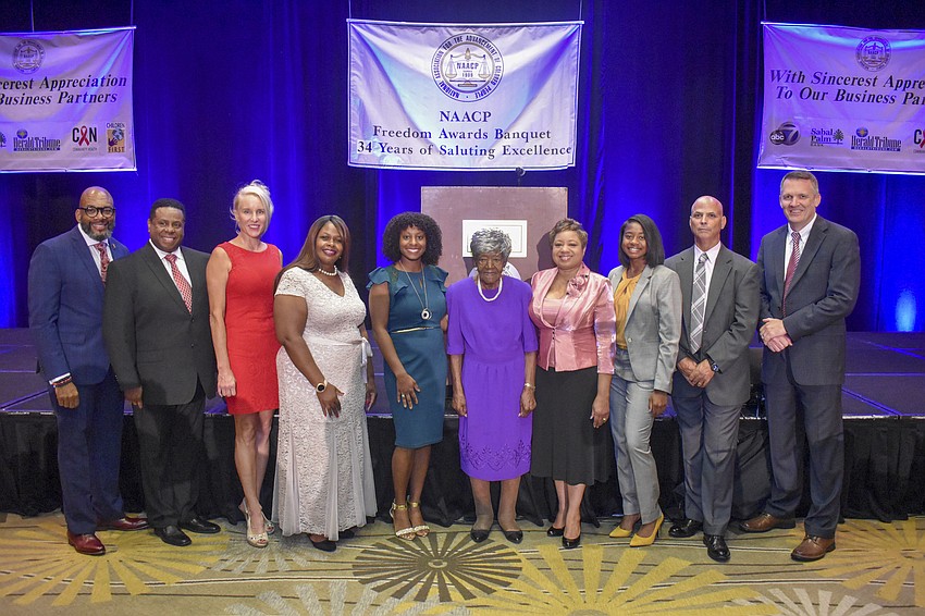 Sarasota NAACP President Trevor Harvey (left) stands for a photo with honorees of the 34th annual Freedom Awards.
