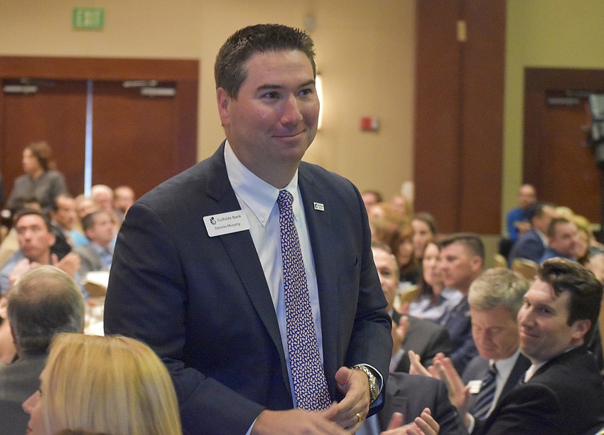 Dennis Murphy walks up to receive the Chair's Cup Award.