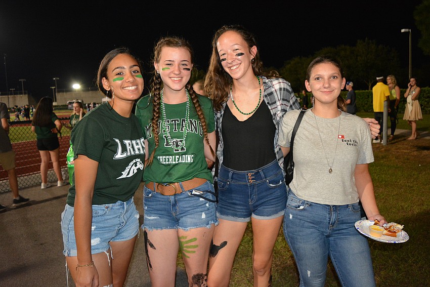 Sophomores Eliana Montero, Amber Parsons, Antonia Boyd and Olivia Sahr are excited that Lakewood Ranch High is winning football games this season.