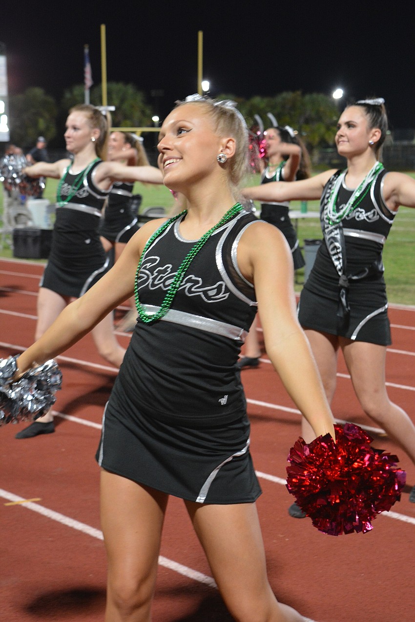 Silver Stars dancer Hana Tomik, a senior, helps energize the crowd with a cheer.