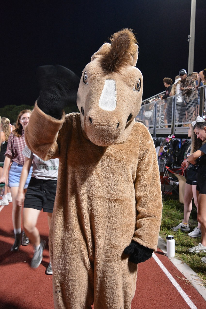 Lakewood Ranch High School's mascot, Klumpy, trots around the field during homecoming.