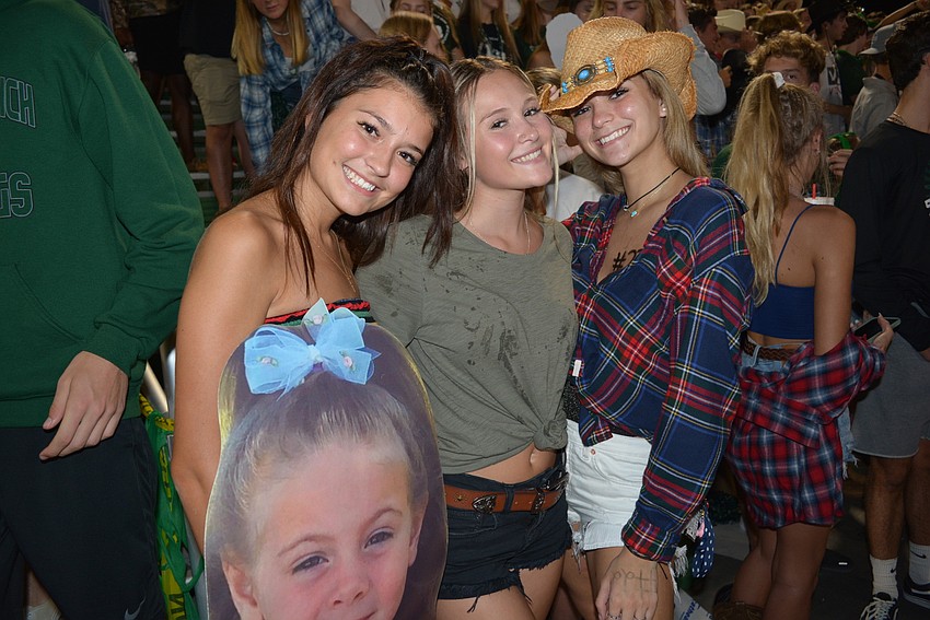 Seniors Vanessa Kratounkov and Kiley Stone and junior Carolina King brought a poster of their friend, cheerleader Hayden Springer.
