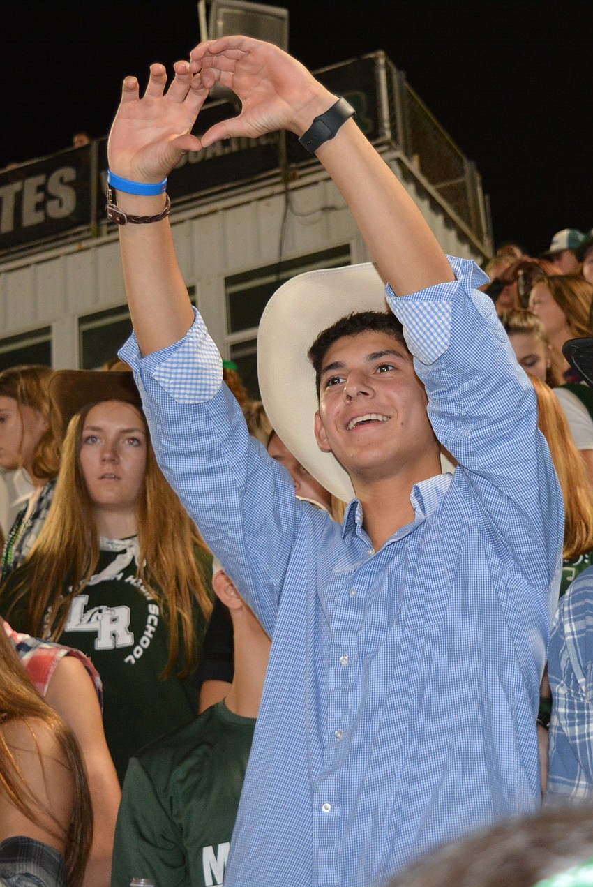 Junior Matthew Donato yells in support of his friend, Dallas Rodriguez, a defensive end.