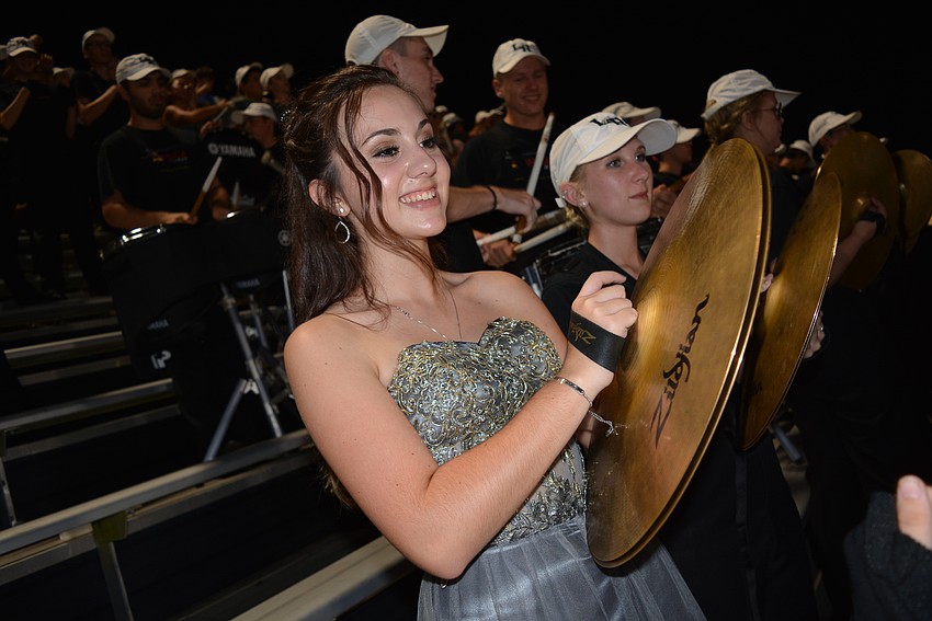 Freshman Angelina Frazzoni traded her typical marching band attire for a formal gown for the evening because she was on the homecoming court.
